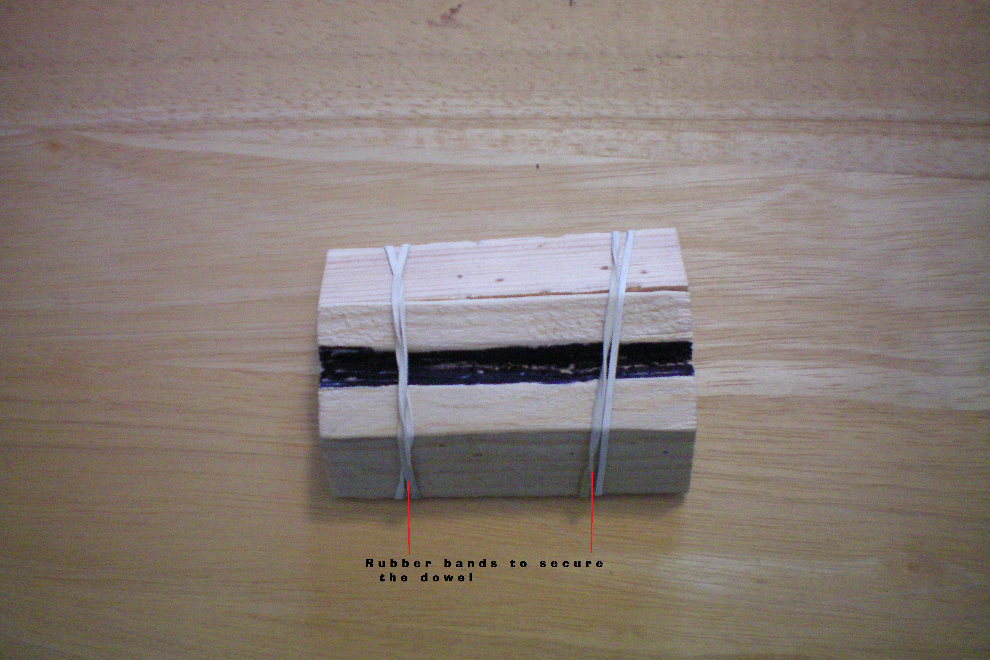 025 labeled Rubber bands to keep dowel aligned for fletching.JPG