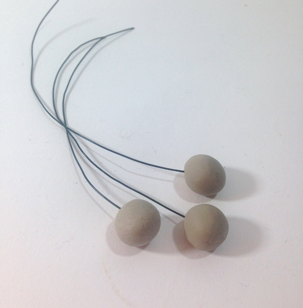 1.clay berries on wire lisa fulmer.jpg