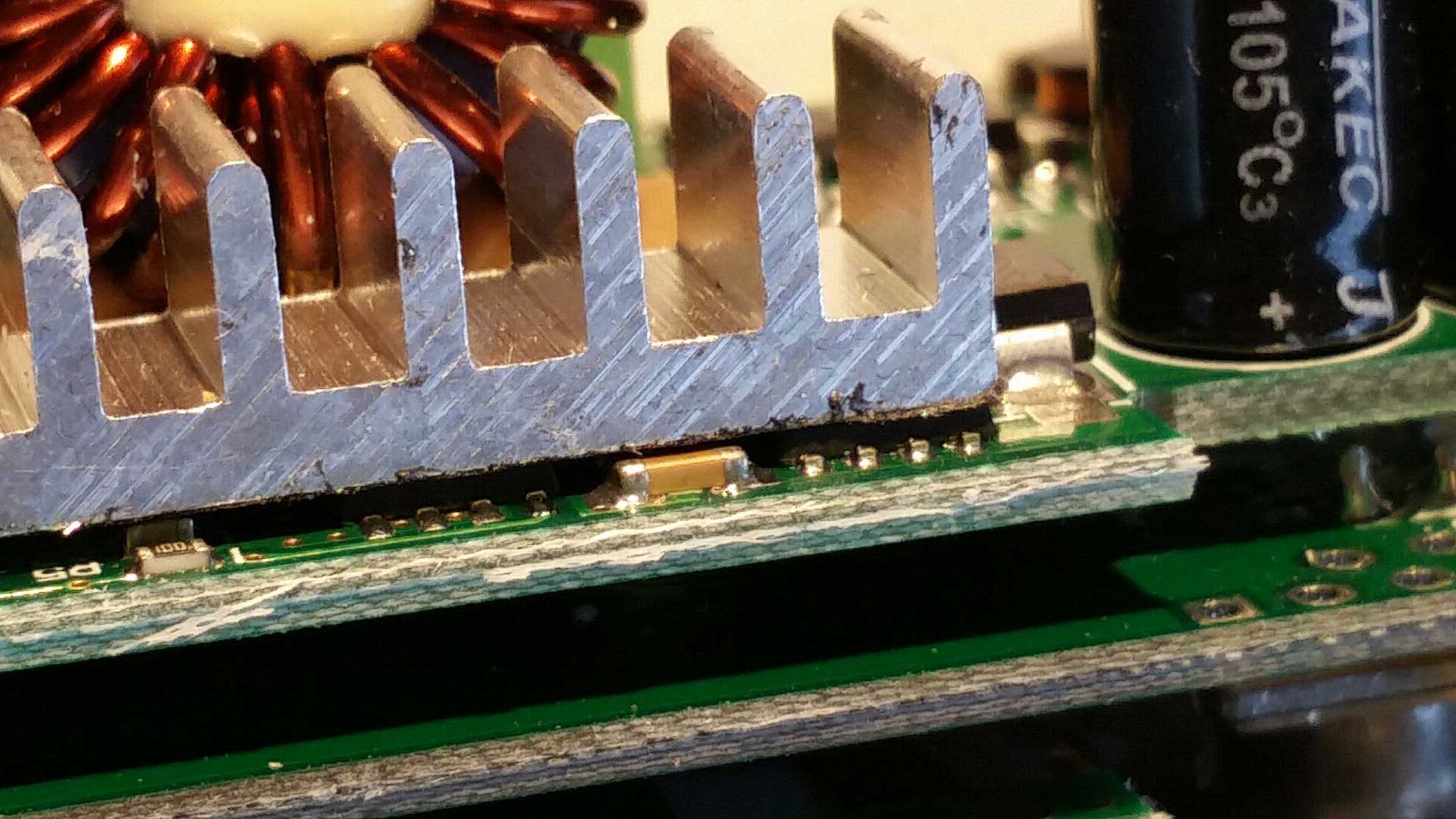 15. DP50V5A heatsink too close to SMD capacitors.jpg