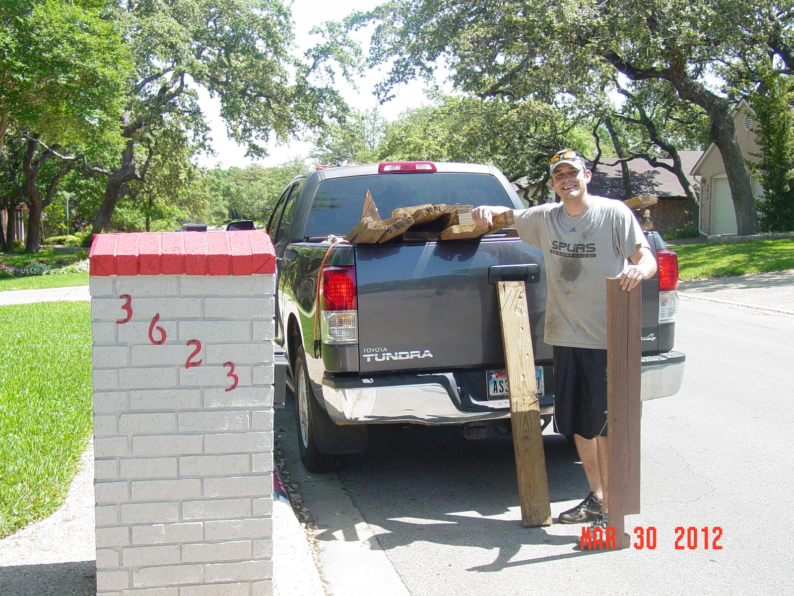 2012 3-30 SA TX FRIDAY - HUNTER WAGNER GOT OUR FREE USED WOOD FROM OUR DECK.JPG