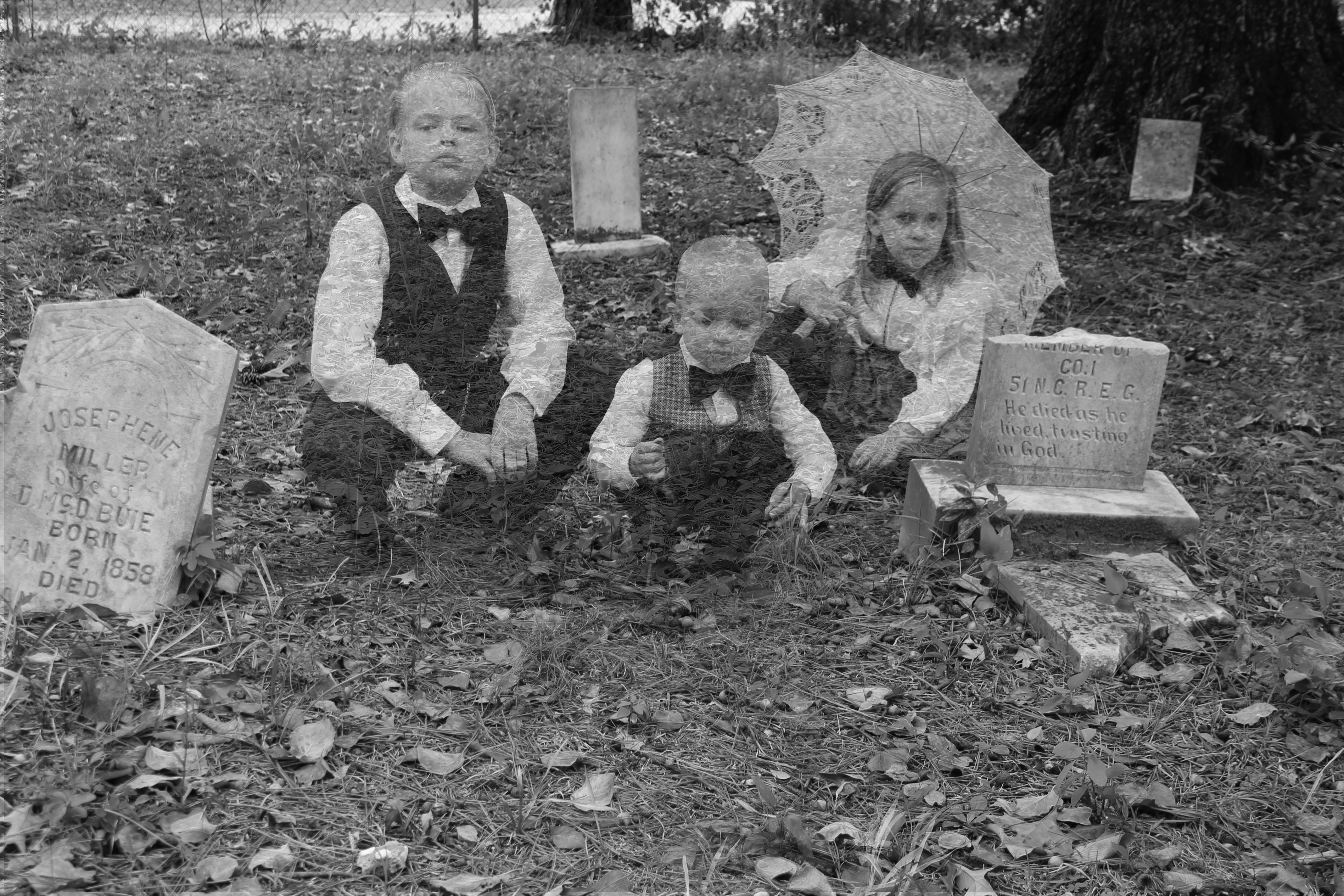 3 kids in graveyard bw jpeg.jpg