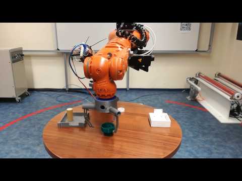 3D printed 3-finger gripper linked to KUKA KR5 robotic arm in action