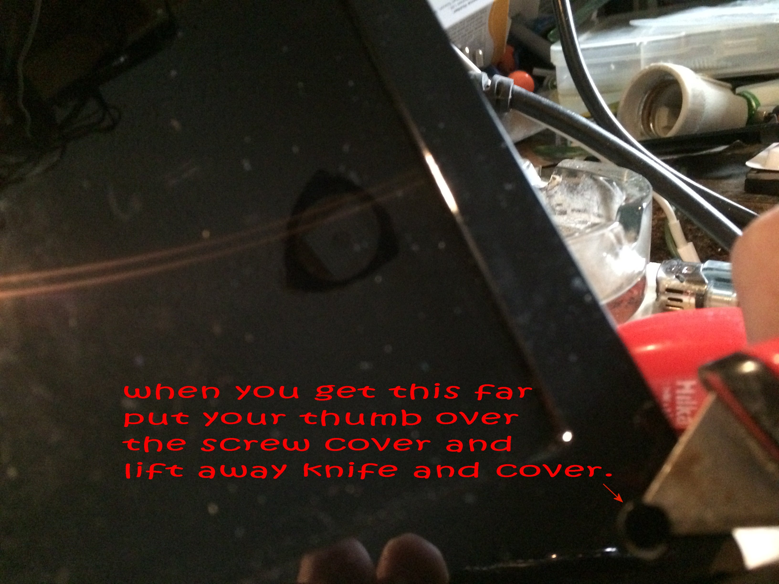 4 Removing screw covers lift it off.jpg