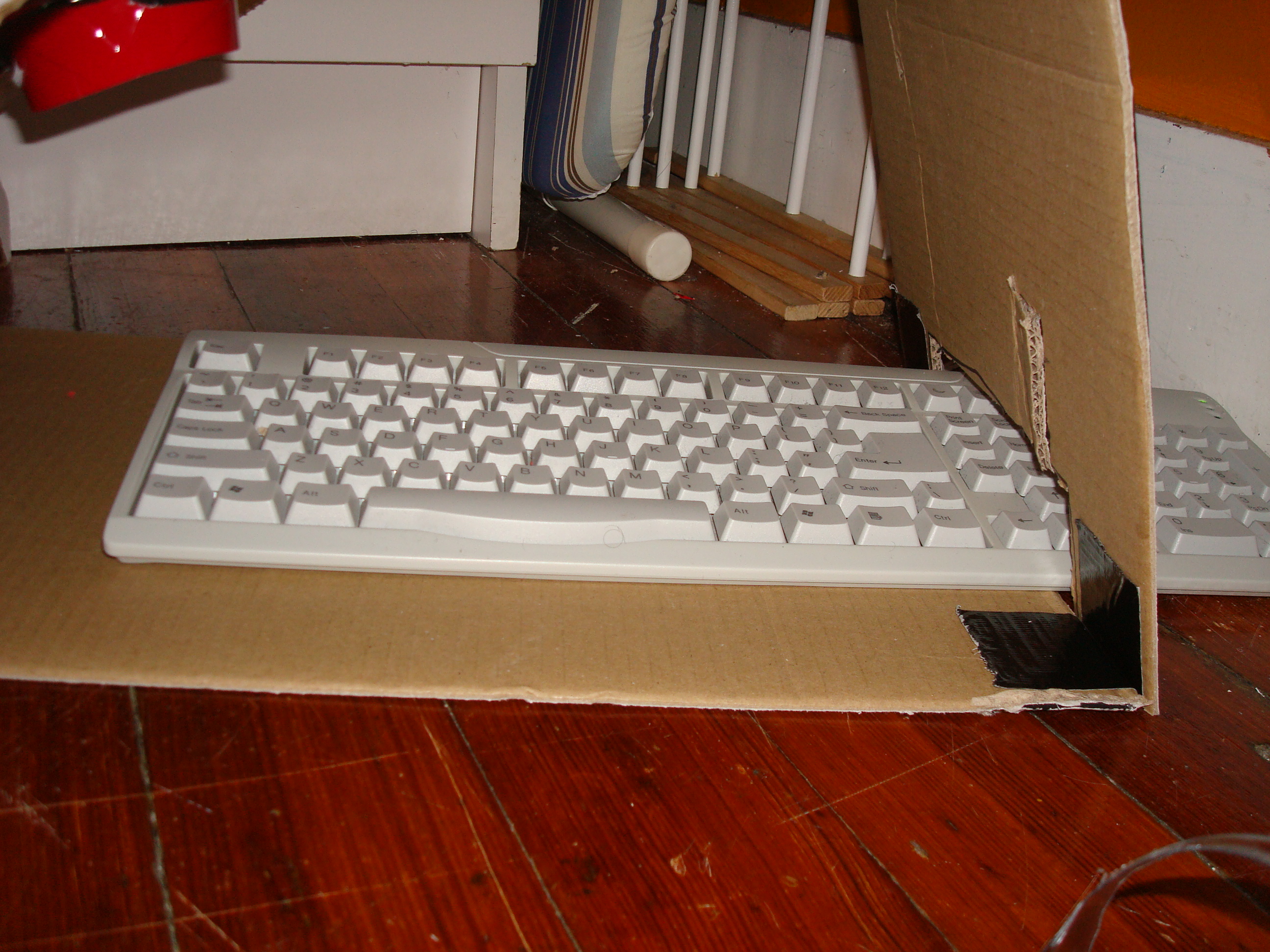 5-1-0_insert_the_keyboard_beneath_cups.JPG