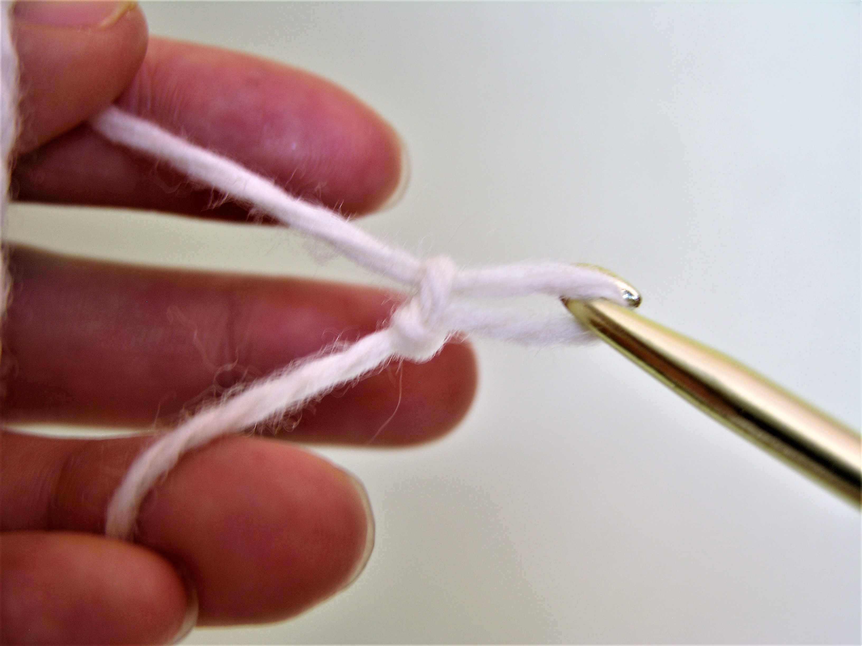 6 slip knot slip yarn off middle finger.JPG