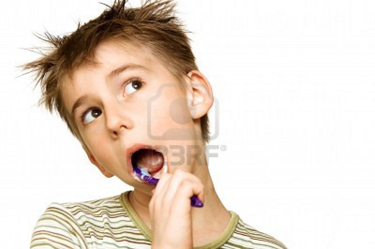 9565565-beautiful-boy-brushing-teeth-isolated-on-white.jpg