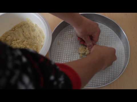 Adding the crust mixture in the pan