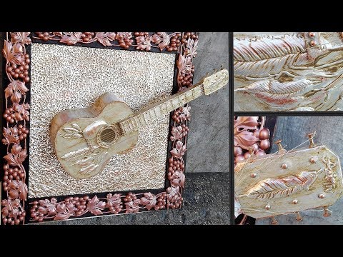 Antique metal embossed guitar