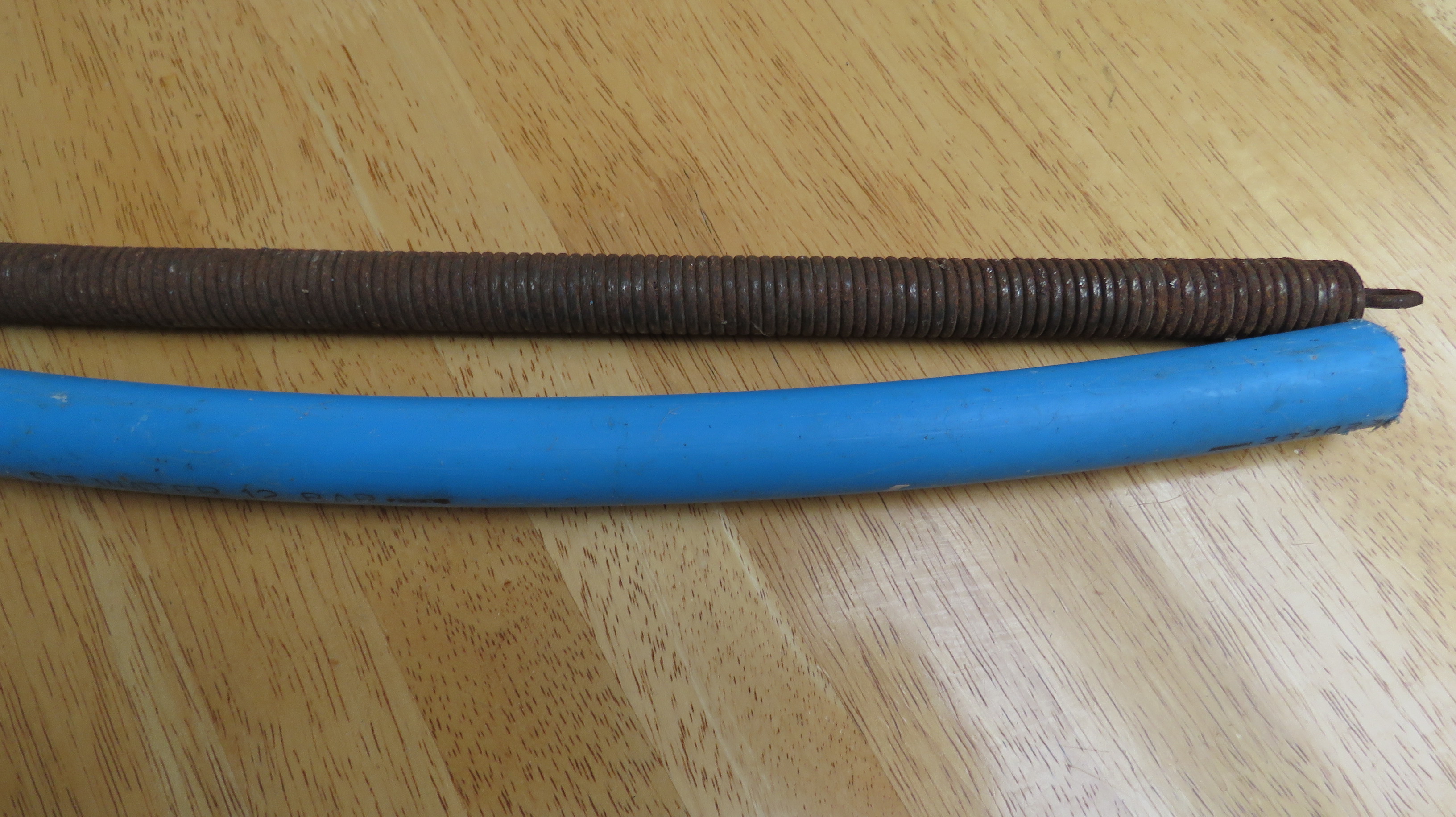 Bending plastic pvc mdpe pipe with heat and plumbers spring (6).JPG