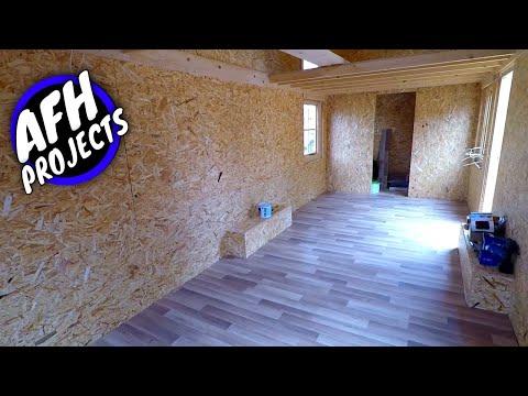 Cheap Tiny House on wheels build #7 - Installing Interior OSB, window trim, laminate flooring