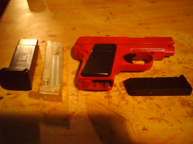 Cheapo Airsoft gun and a few spare clips..jpg