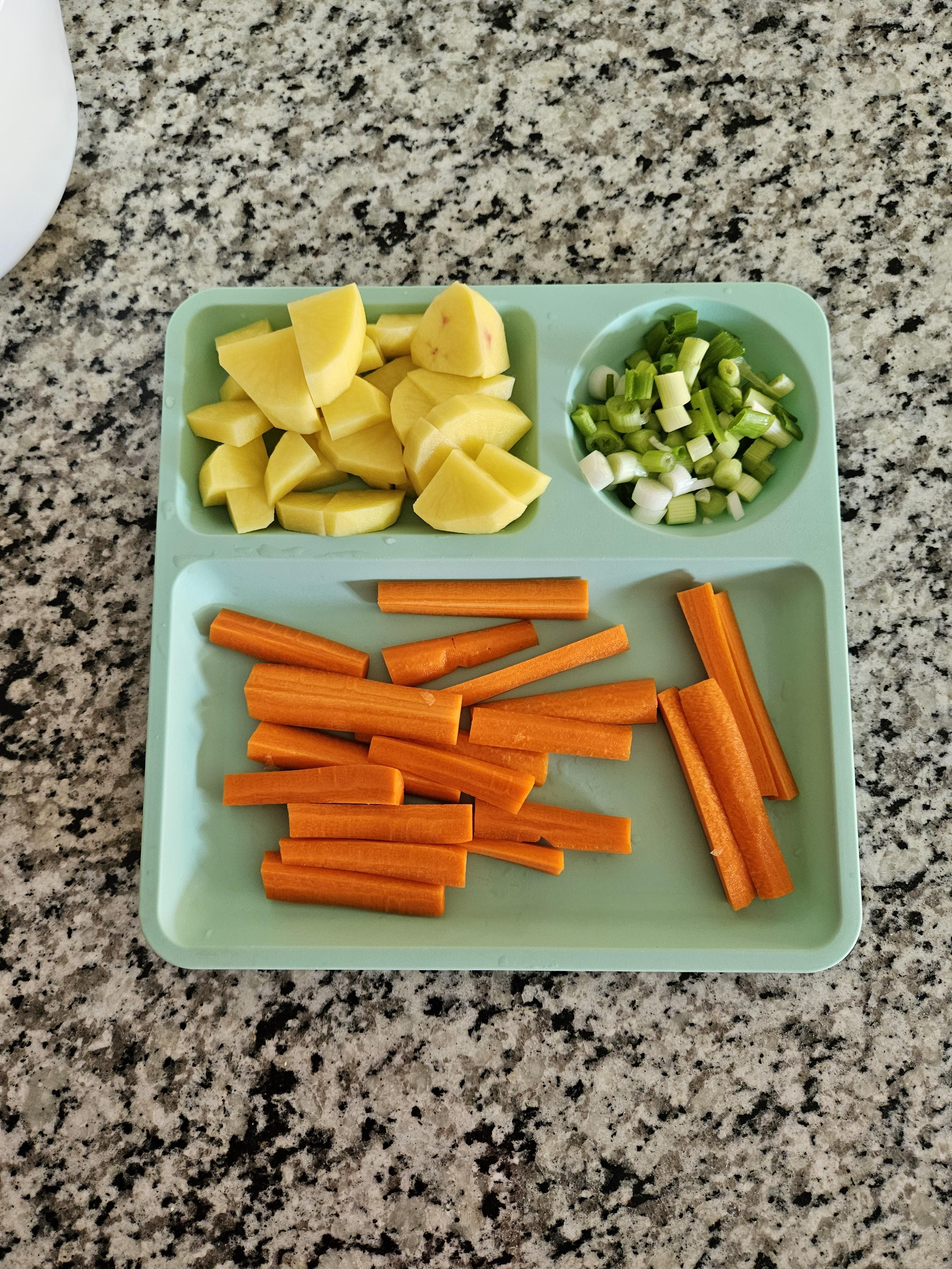 Chopped carrots, green onions and potateos.jpg