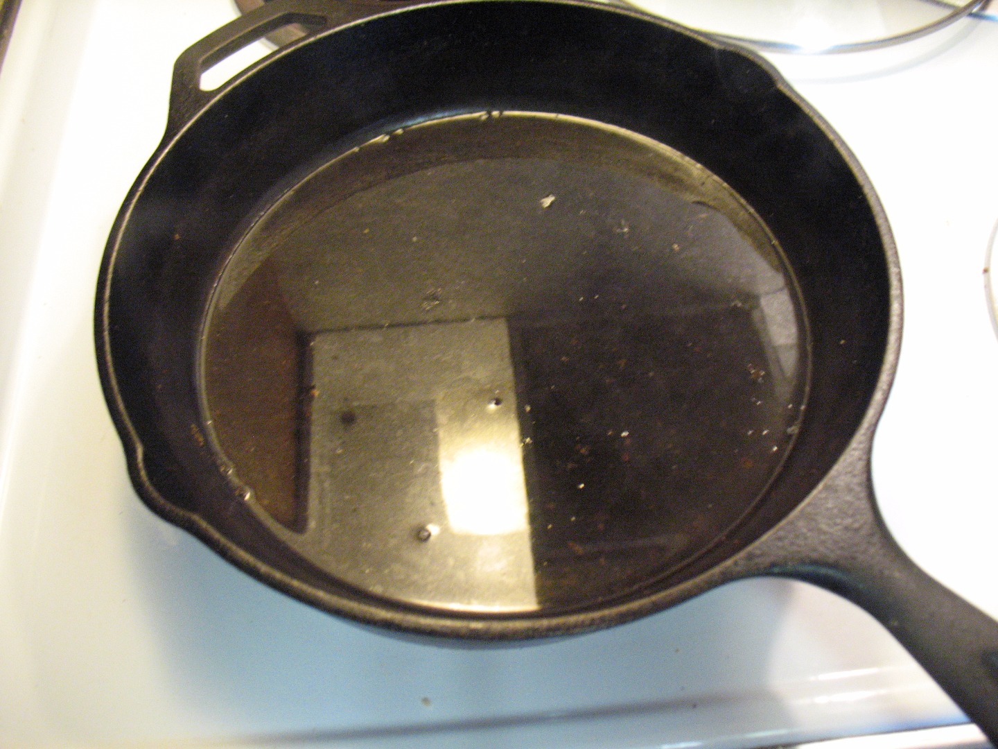 Cleaning a hot skillet.JPG