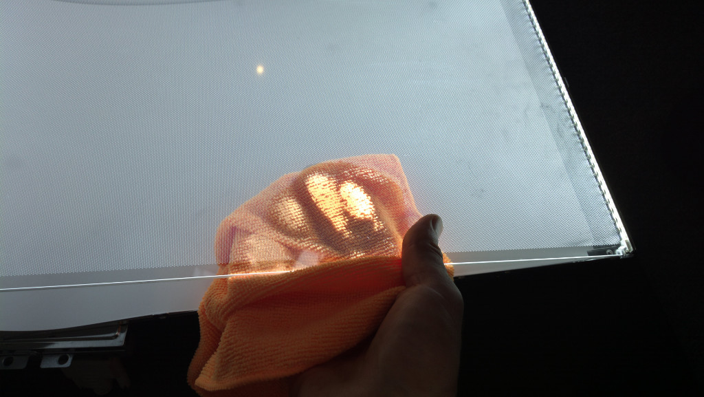 Cleaning the plastic reflector plate LEDs on.jpg