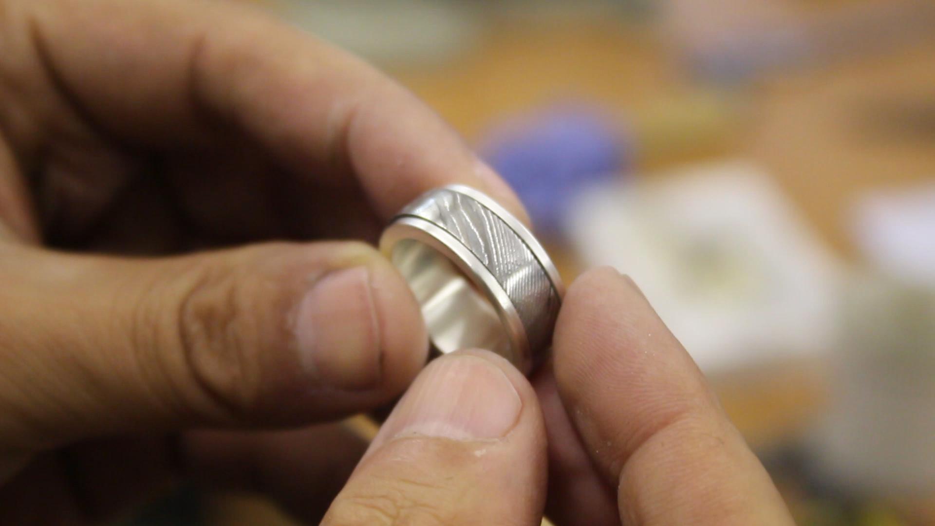 Damascus steel and silver spinner ring 1.jpg