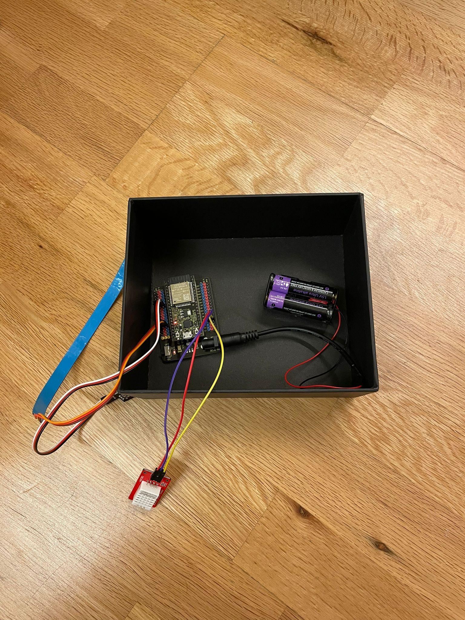 Device inside box with necessary parts out.jpeg