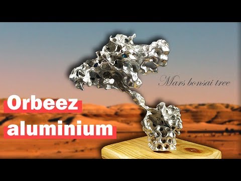 Futuristic Martian tree sculpture made with aluminium poured in to Orbeez