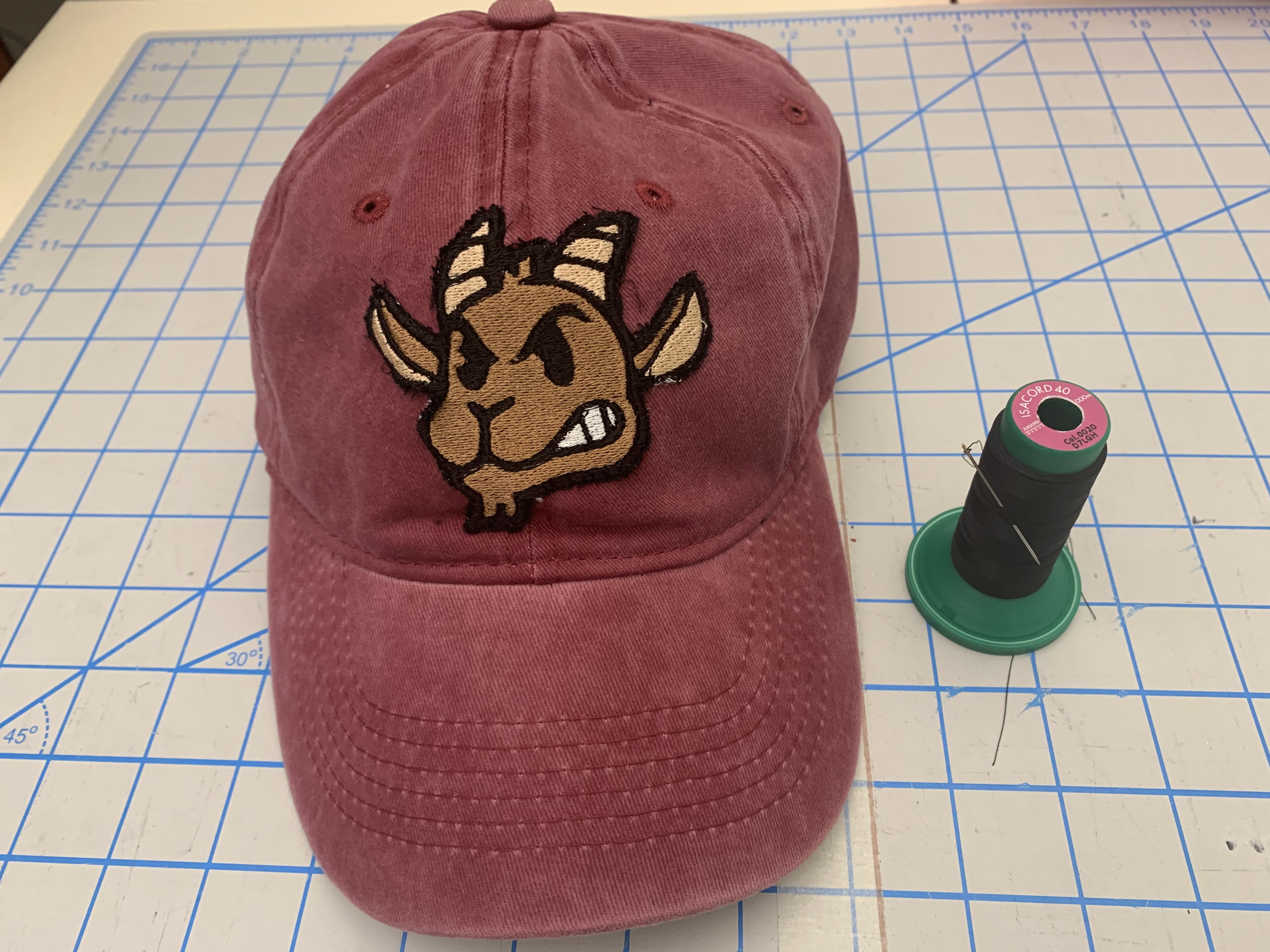 Hand sew patch to hat.jpg