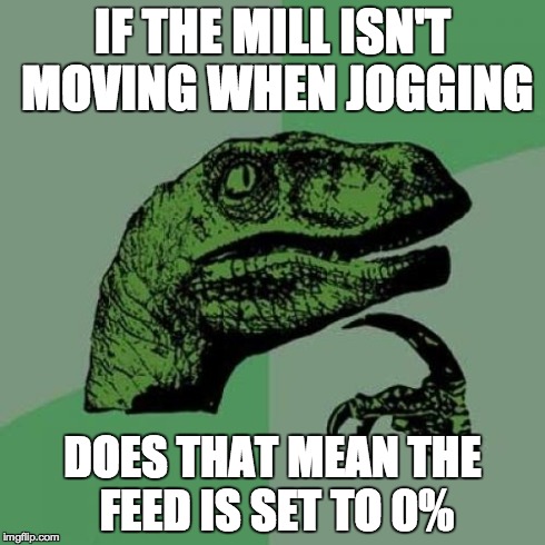 If the mill isn't moving when jogging, the feed is probably set to zero %.jpg