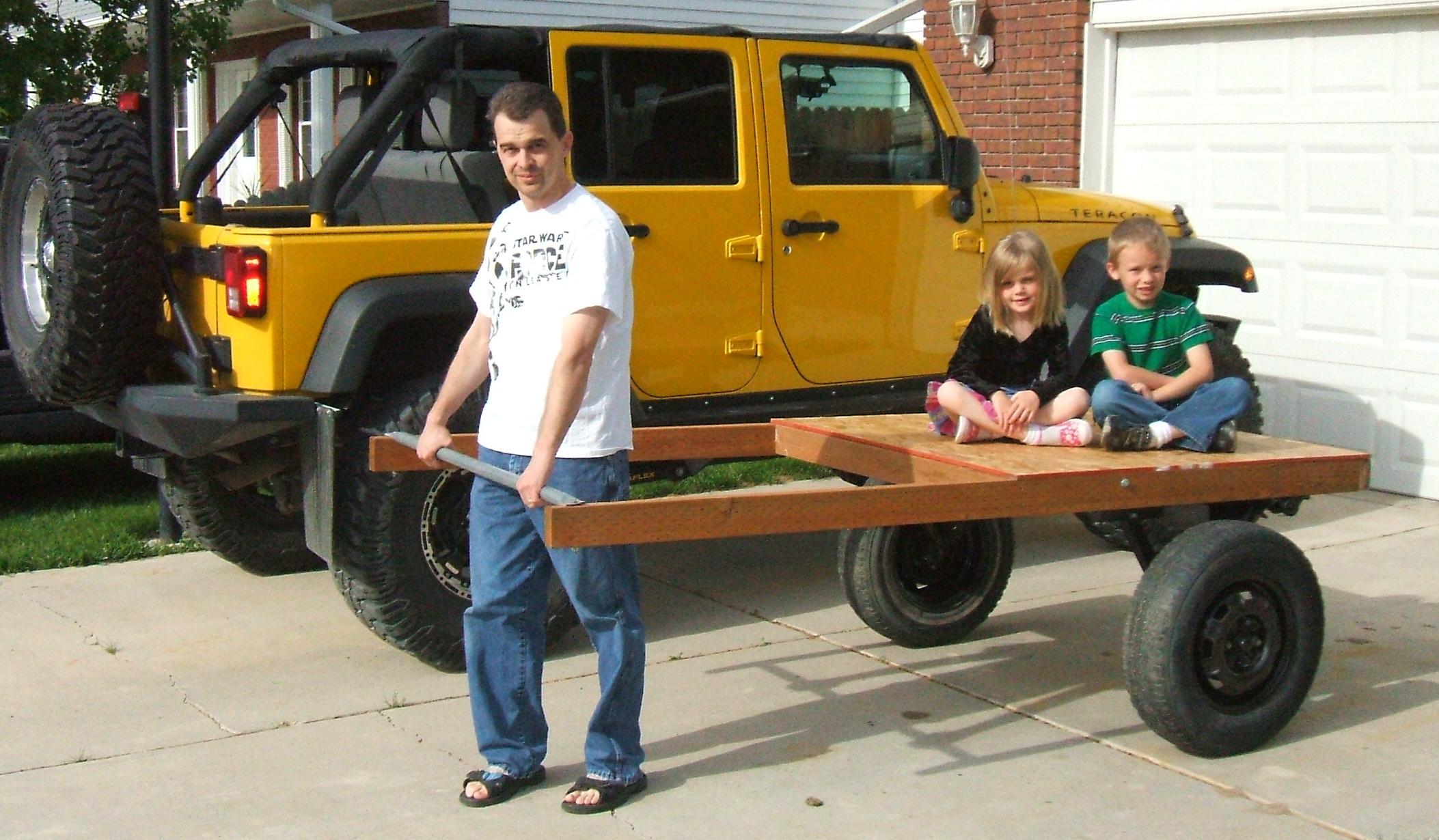 Joe, Logan, and Harlie in front of Jeep.jpg