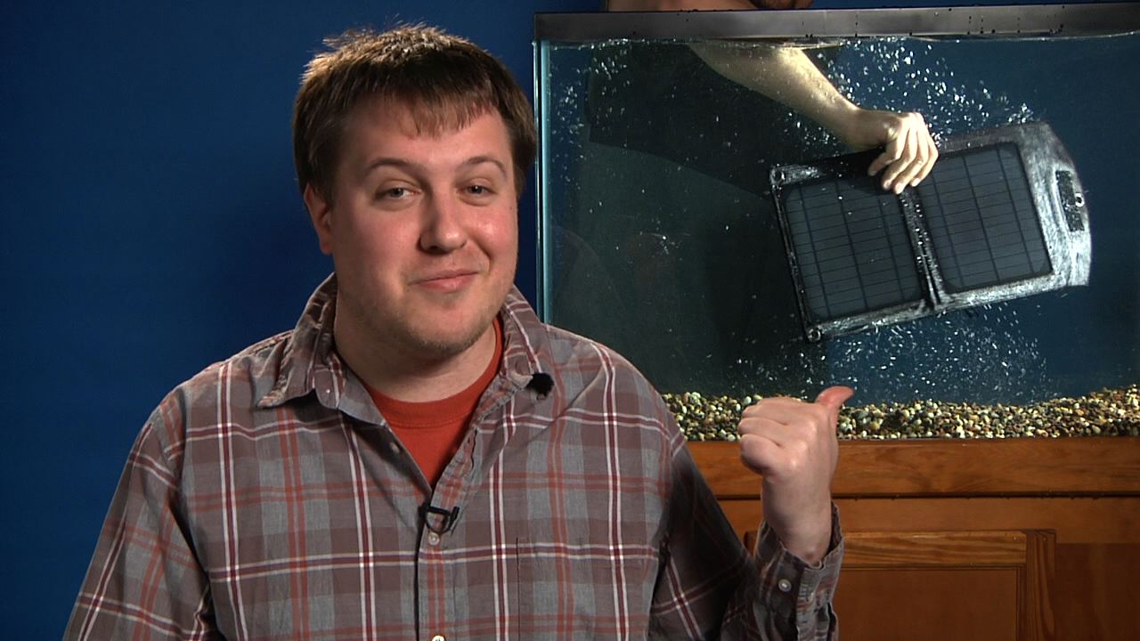 Josh smirks w solar panel in tank.jpg