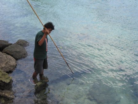 Local boy spear-fishing along the KB Dock-side.jpg