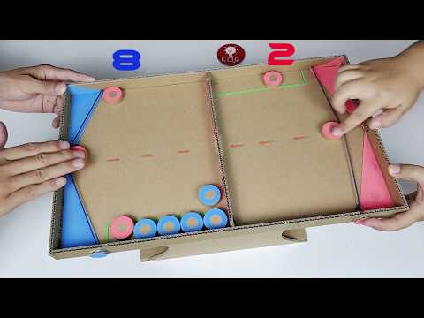 Making two people shuffleboard tabletop toys in household cardboard