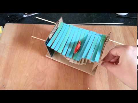 Mechanical cardboard wave machine toy