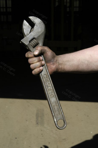 P16 036 Worker With Dirty Hand Holds Large Crescent Wrench, Adjustable End Wrench.jpg