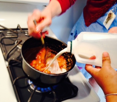 Pouring milk into melted caramel.jpg