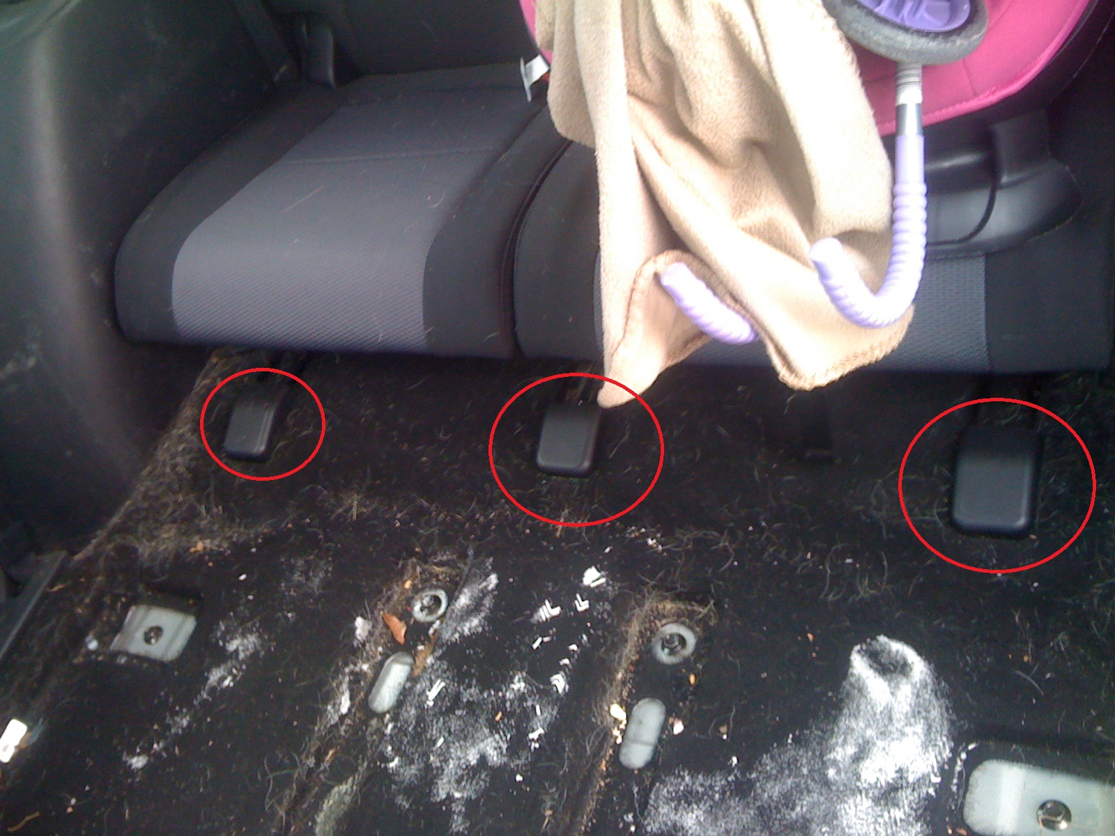 Rear seat bolt covers.JPG