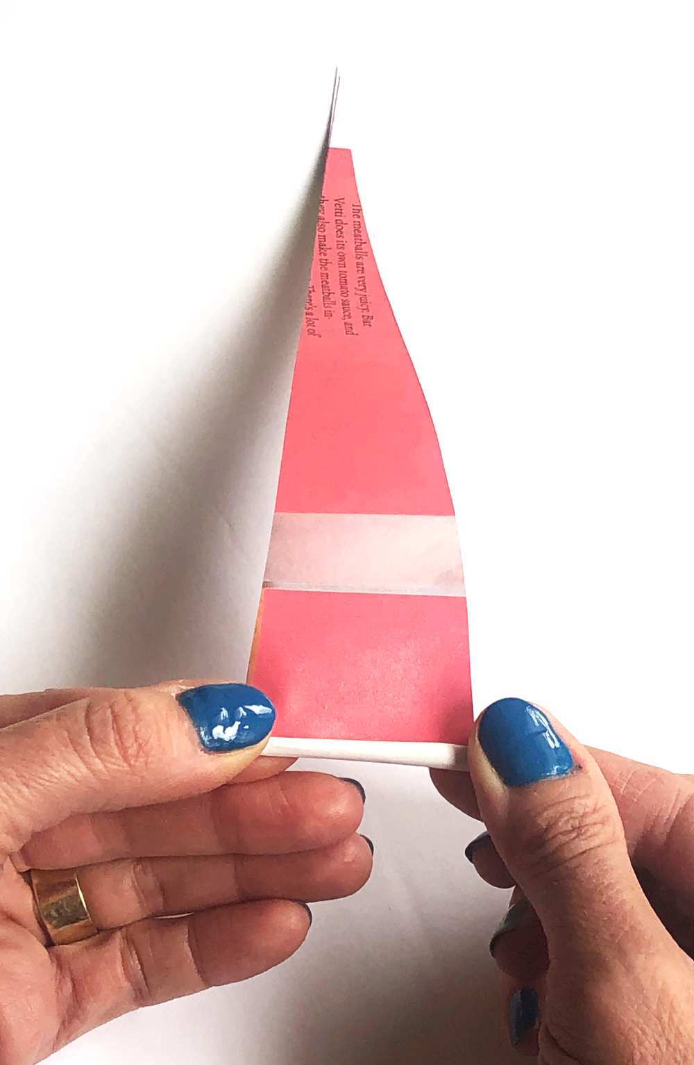 Rolling a paper triangle into a bead.jpg