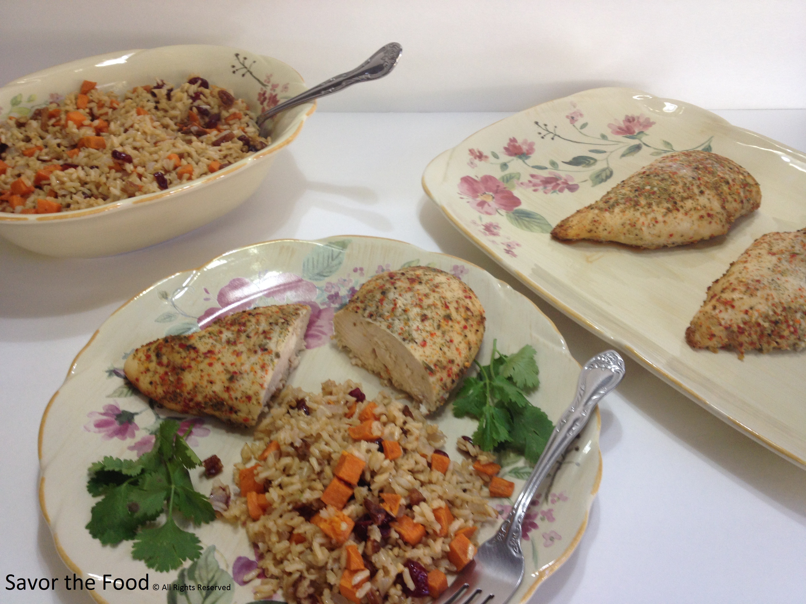 Seasoned Chicken Breast with a side dish of Sweet Potato Pilaf with Cranberries and Pecans.jpg