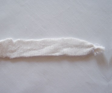 Sewing the tubular bandage.jpg