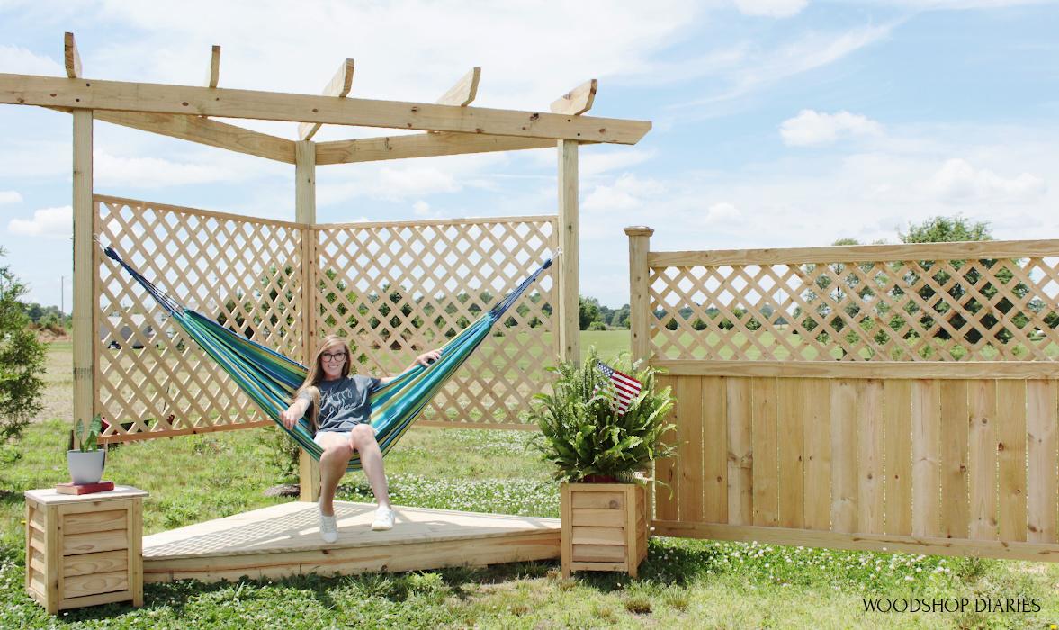 Shara sitting in hammock stand on floating deck large.jpg