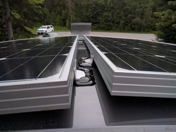 Solar Panels Installation, sealing the brackets.jpg