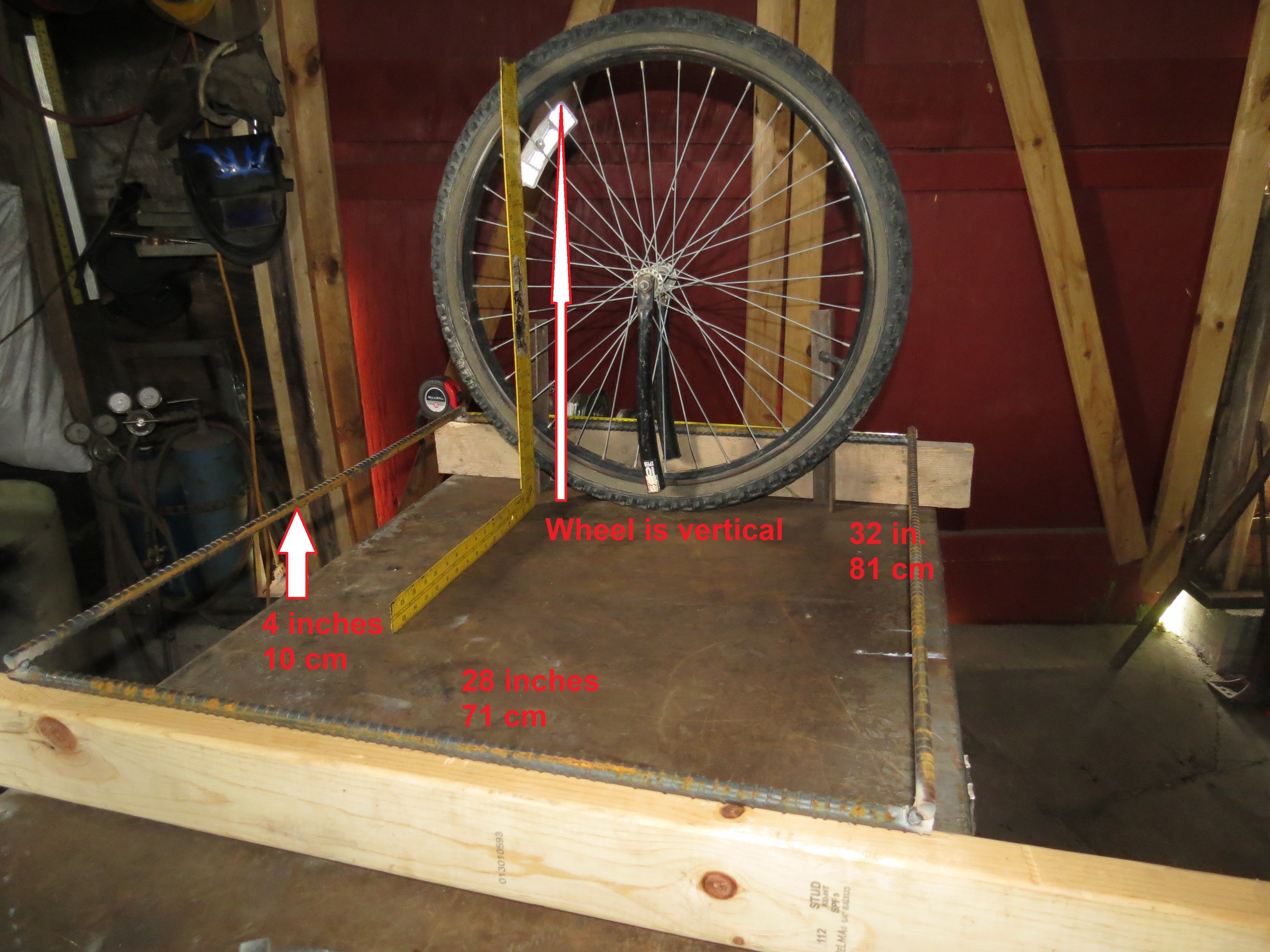 Step 04 Elevate frame 4in and stand up wheel inside it.JPG