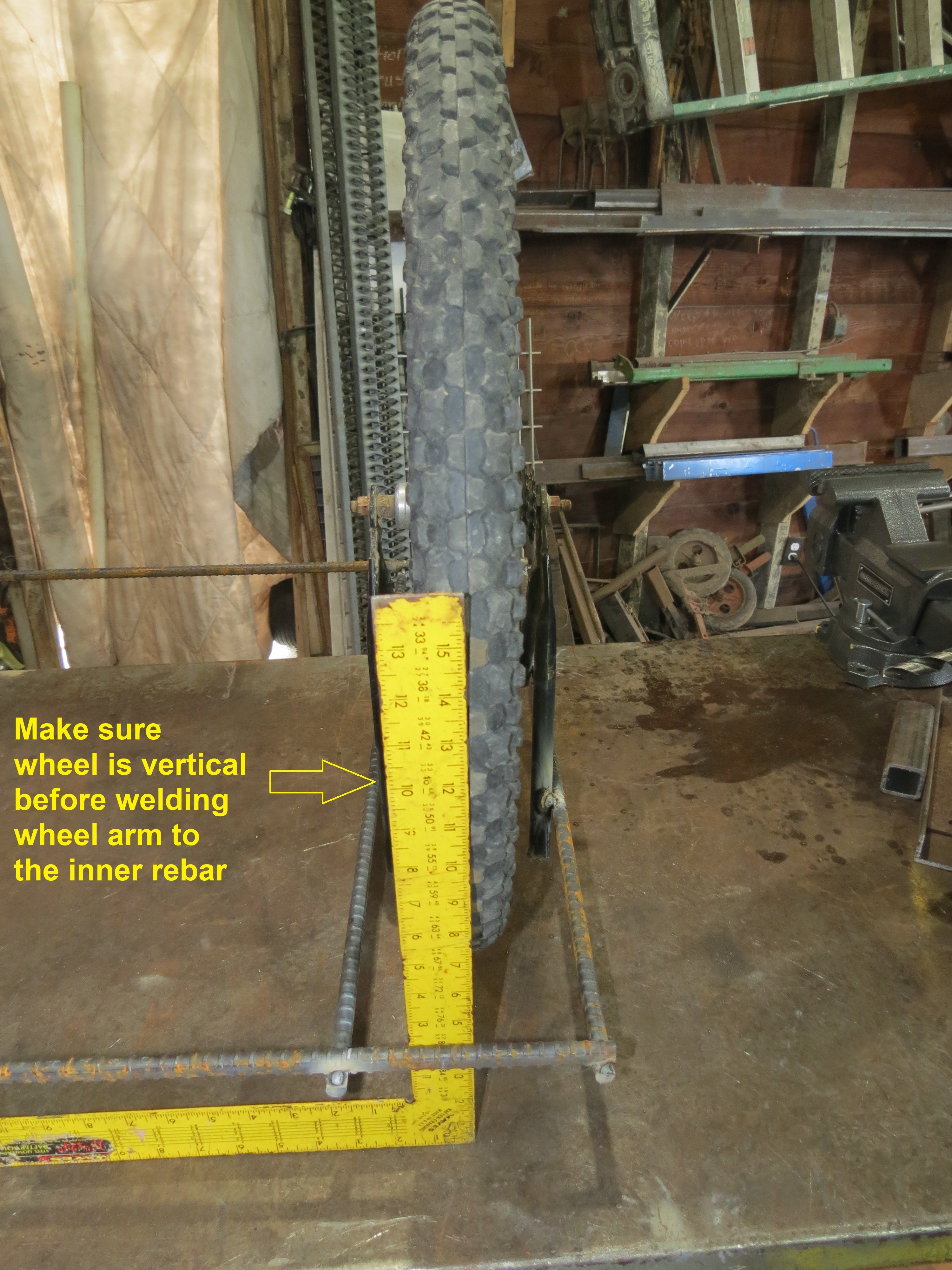 Step 08 Make sure wheel is vertical then weld its arm to second 28in bar.JPG