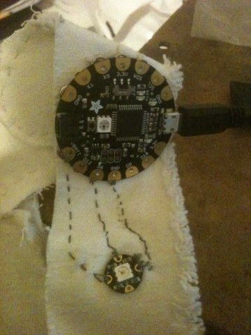 Tested one neopixel to flora with conductive thread off.jpg