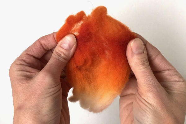 Thin-the-wool-roving-before-beginning-to-needle-felt.jpg