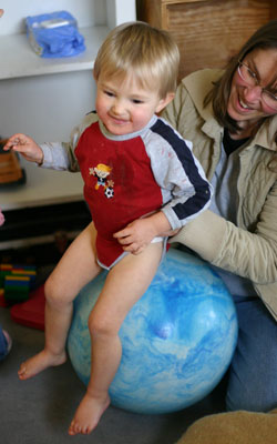 Tot Being Bounced on Ball