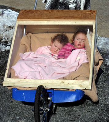 Tots Sleeping In Warm Stroller