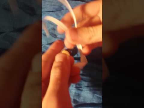 Tying the pokeball keychain