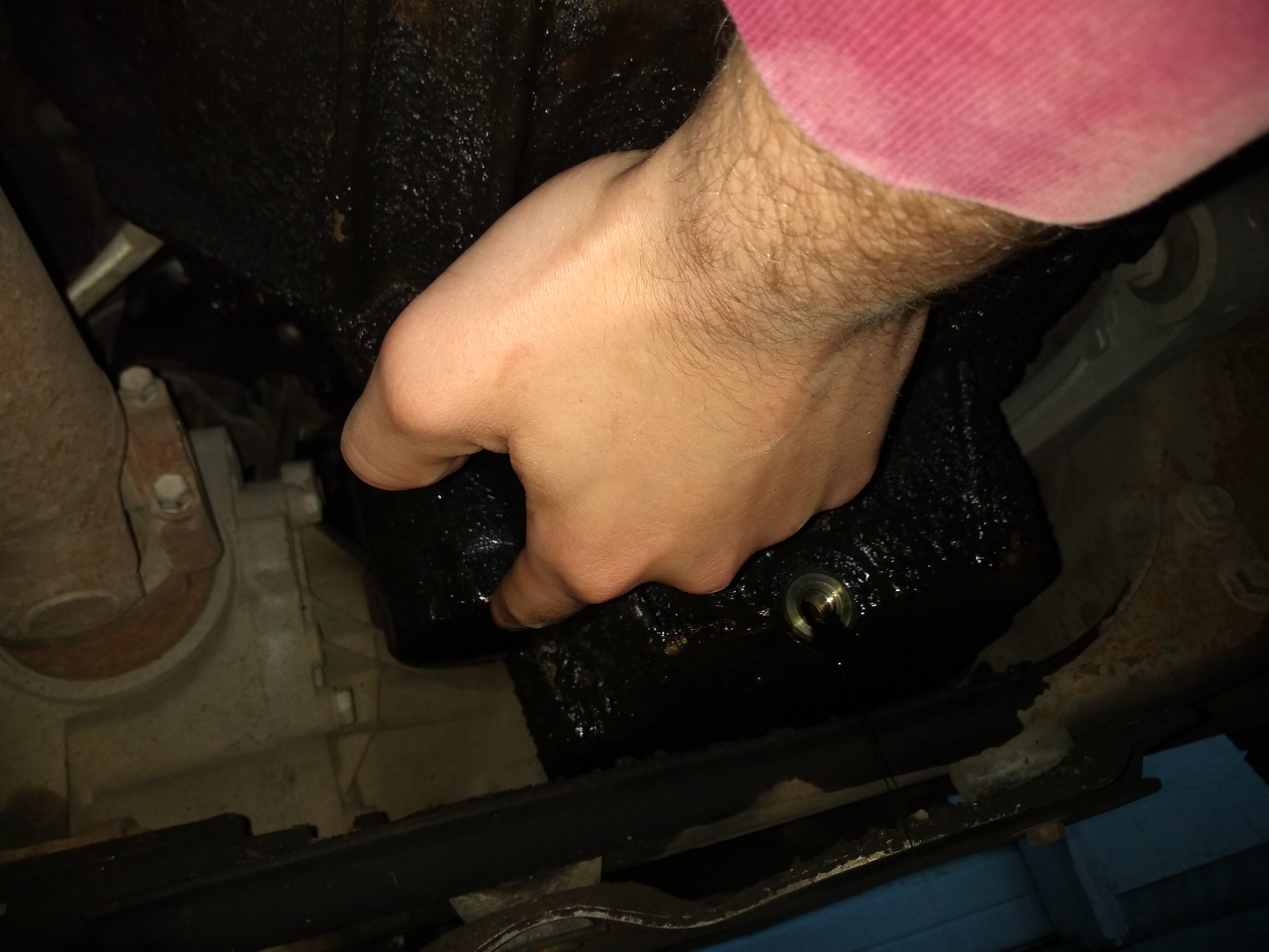 Unscrewing oil filter.jpg