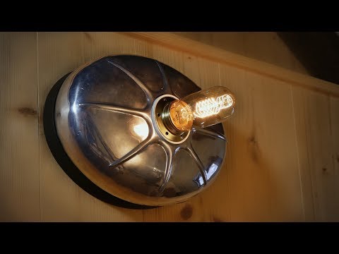 Upcycled hot water bottle in a wall lamp