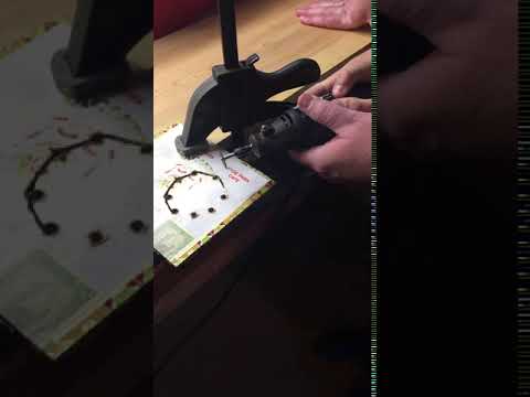 Using Dremel MultiPro with cutting disc to cut out hole in cigar box.