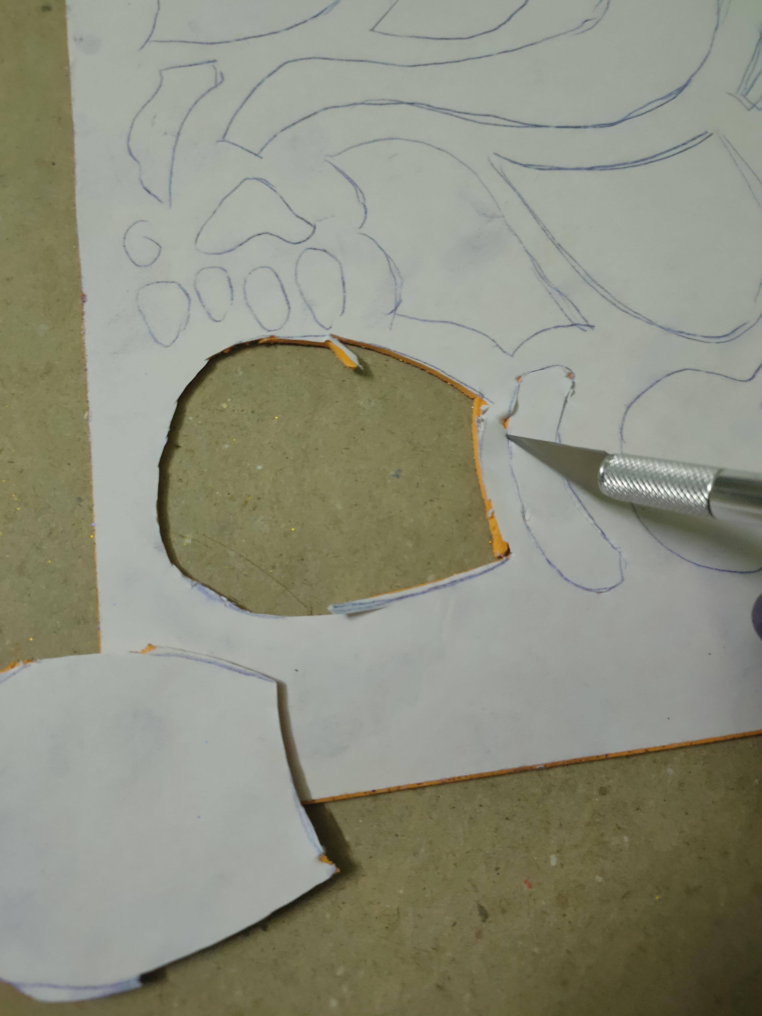 Using stencil cutter to cut the pieces apart.jpg