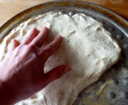 With wet fingers press dough.JPG