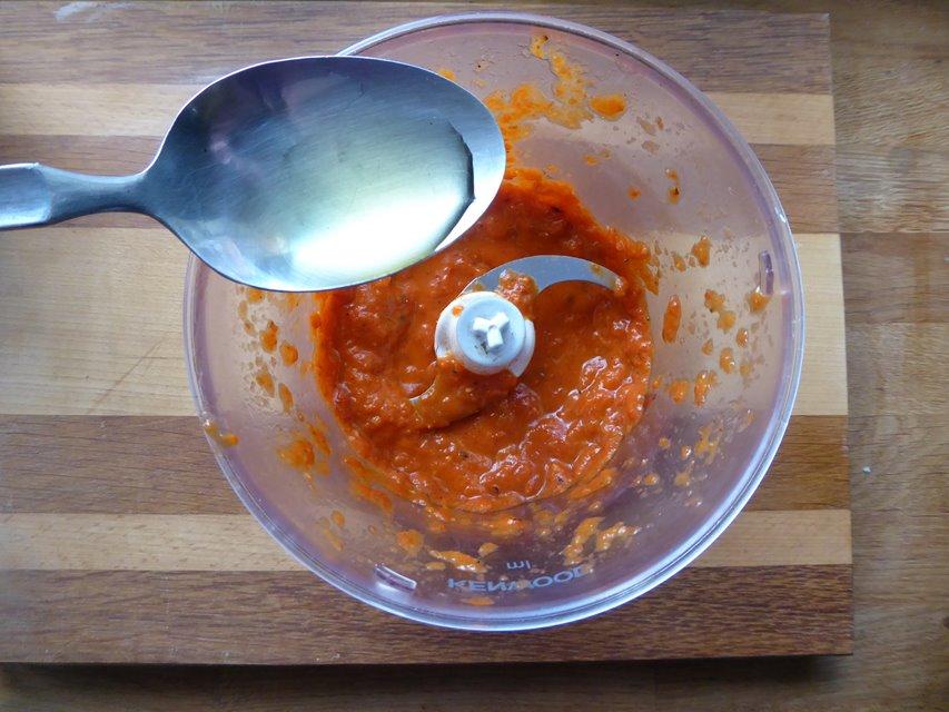 add oil to pepper and tomato pesto.JPG