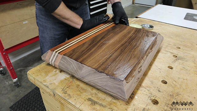 applying finish to cutting board II.jpg